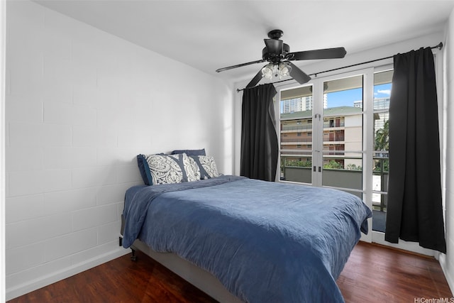 445 Kaiolu St Unit 407, Honolulu, HI 96815 - bedroom with dark wood-style floors and ceiling fan