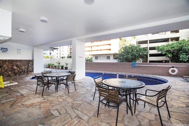 445 Kaiolu St Unit 407, Honolulu, HI 96815 - view of patio / terrace with outdoor dining area and a community pool