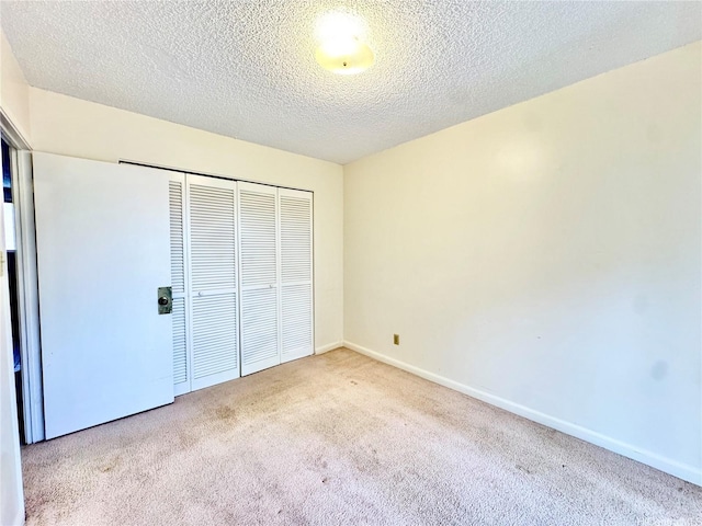 1036 Green St Unit 204, Honolulu, HI 96822 - unfurnished bedroom featuring carpet, a closet, and a textured ceiling