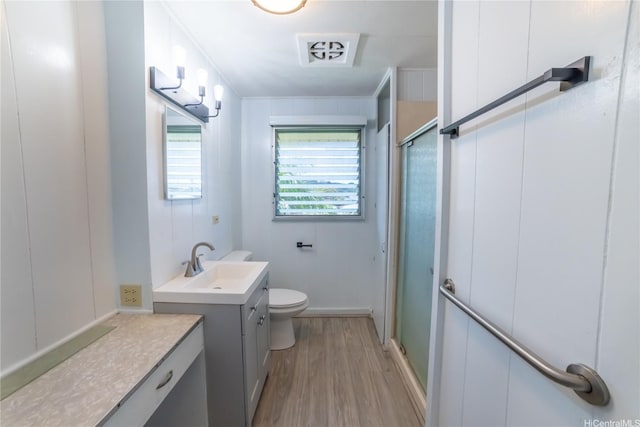 741 Alewa Dr Unit A, Honolulu, HI 96817 - full bathroom featuring vanity, wood finished floors, and a shower with door