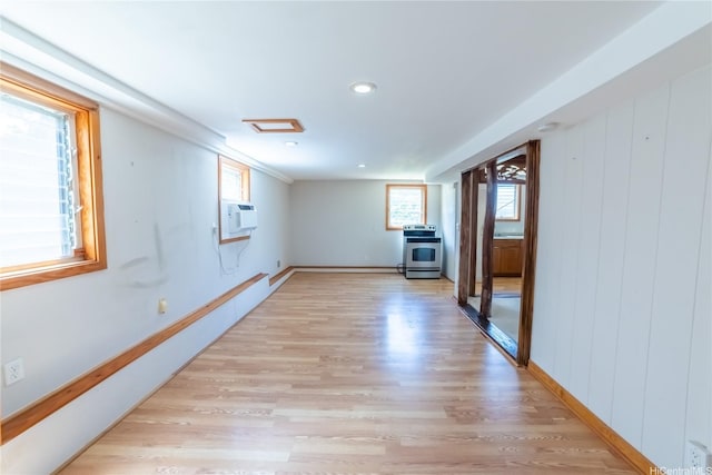 741 Alewa Dr Unit A, Honolulu, HI 96817 - spare room featuring light wood finished floors, a wall mounted air conditioner, recessed lighting, and a wood stove