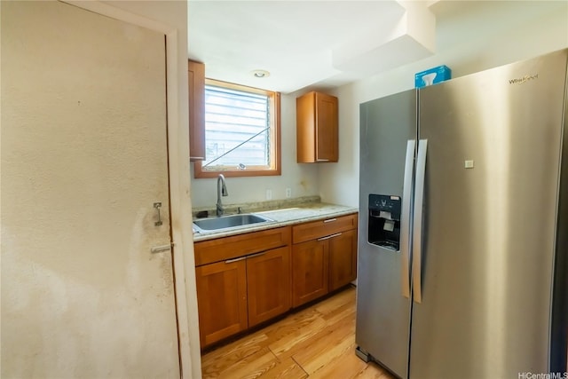 741 Alewa Dr Unit A, Honolulu, HI 96817 - kitchen featuring stainless steel fridge with ice dispenser, brown cabinets, light countertops, and light wood-style floors