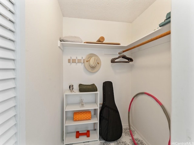 46-63 Emepela Pl Unit P205, Kaneohe, HI 96744 - walk in closet featuring tile patterned flooring