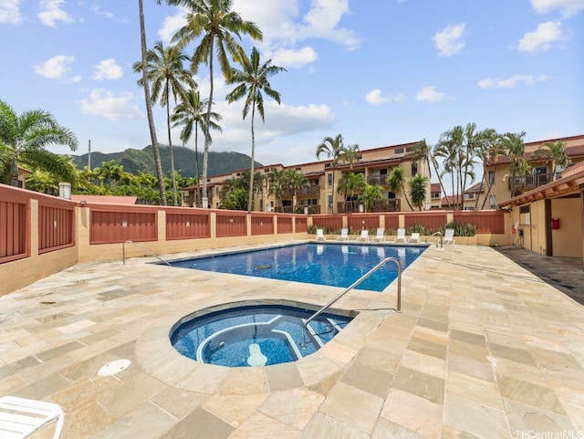 46-63 Emepela Pl Unit P205, Kaneohe, HI 96744 - community pool featuring a mountain view, a community hot tub, and a patio