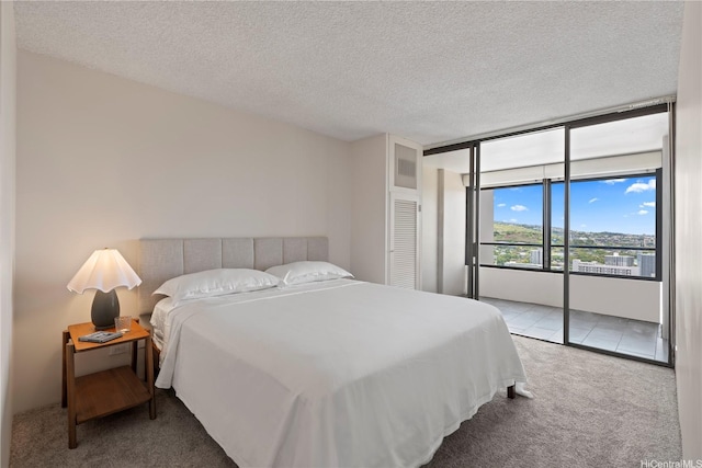 1717 Mott Smith Dr Unit 2811, Honolulu, HI 96822 - bedroom with carpet floors, access to outside, and a textured ceiling