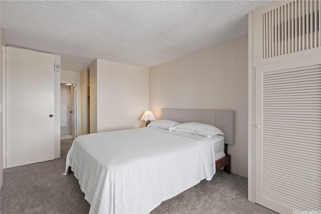 1717 Mott Smith Dr Unit 2811, Honolulu, HI 96822 - bedroom featuring carpet floors and a textured ceiling