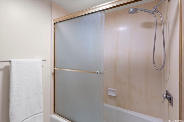 1717 Mott Smith Dr Unit 2811, Honolulu, HI 96822 - bathroom featuring combined bath / shower with glass door