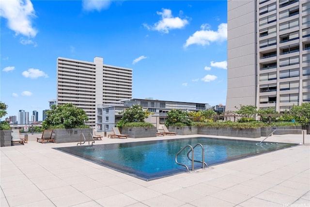 1717 Mott Smith Dr Unit 2811, Honolulu, HI 96822 - community pool featuring a patio area and a view of city