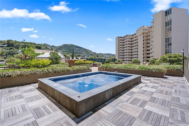 1717 Mott Smith Dr Unit 2811, Honolulu, HI 96822 - view of pool featuring an outdoor hot tub and a mountain view