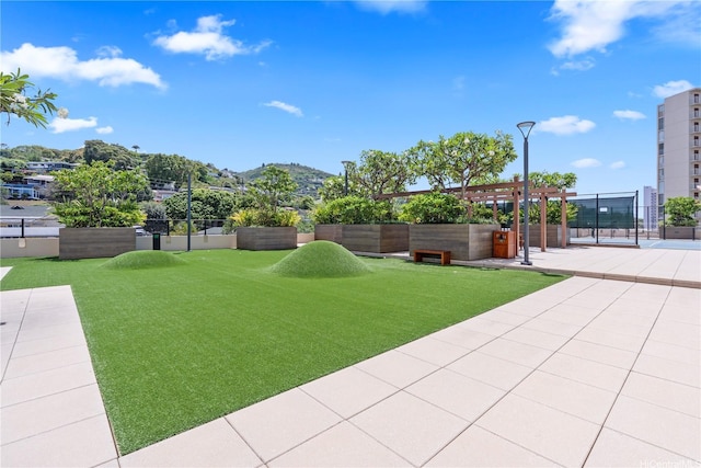 1717 Mott Smith Dr Unit 2811, Honolulu, HI 96822 - view of yard featuring a pergola and a mountain view