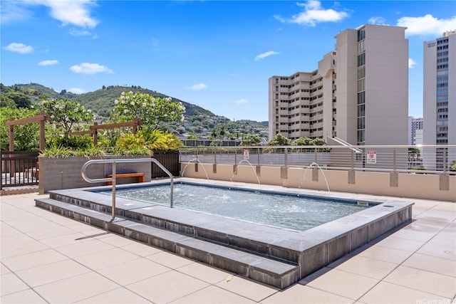 1717 Mott Smith Dr Unit 2811, Honolulu, HI 96822 - view of swimming pool with a mountain view and an in-ground hot tub