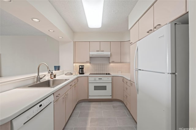 1717 Mott Smith Dr Unit 2811, Honolulu, HI 96822 - kitchen with white appliances, under cabinet range hood, recessed lighting, light countertops, and tasteful backsplash