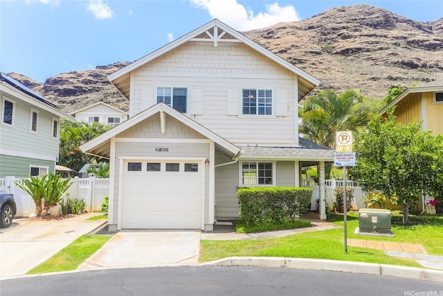 87-2113 Pakeke St, Waianae, HI 96792 - view of front of home featuring a mountain view, concrete driveway, and a garage