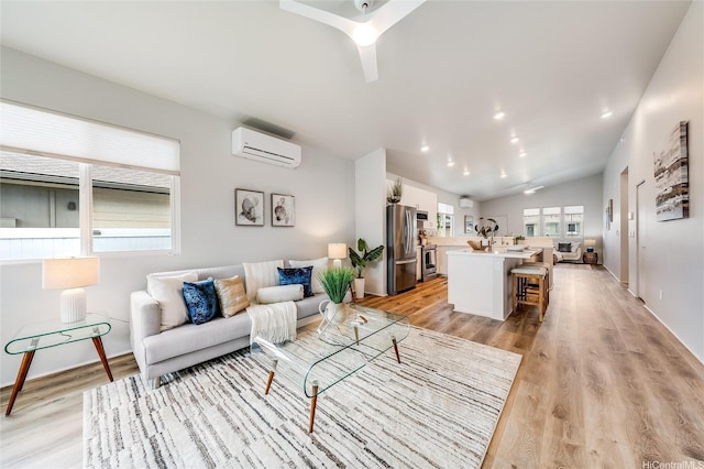 91-1804 Kohanahana Loop, Ewa Beach, HI 96706 - living area with a wall mounted air conditioner, vaulted ceiling, light wood-type flooring, and a ceiling fan