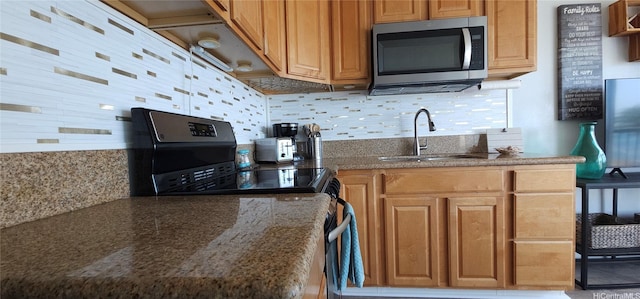 85-175 Farrington Hwy Unit A315, Waianae, HI 96792 - kitchen featuring stainless steel microwave, electric range, tasteful backsplash, and dark stone countertops
