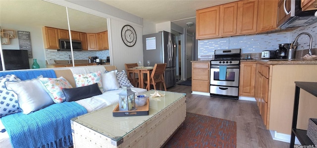 85-175 Farrington Hwy Unit A315, Waianae, HI 96792 - kitchen with stainless steel appliances, dark wood-style floors, and backsplash