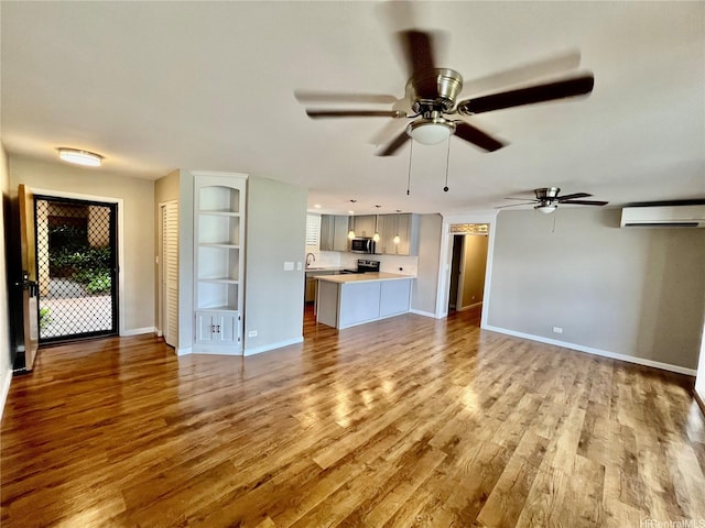 46-035 Konohiki St Unit 3832, Kaneohe, HI 96744 - unfurnished living room featuring a wall mounted air conditioner, ceiling fan, and wood finished floors