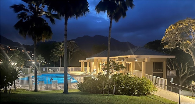 46-035 Konohiki St Unit 3832, Kaneohe, HI 96744 - pool at night featuring a community pool