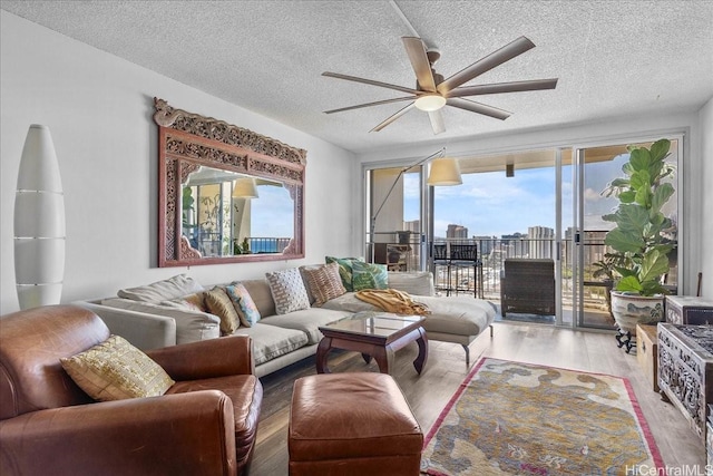 1350 Ala Moana Blvd Unit 3004, Honolulu, HI 96814 - living area with ceiling fan, wood finished floors, and a textured ceiling