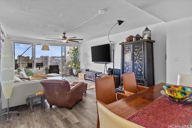 1350 Ala Moana Blvd Unit 3004, Honolulu, HI 96814 - living room featuring a ceiling fan, wood finished floors, a textured ceiling, and expansive windows