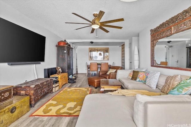 1350 Ala Moana Blvd Unit 3004, Honolulu, HI 96814 - living room featuring wood finished floors, ceiling fan, and a textured ceiling