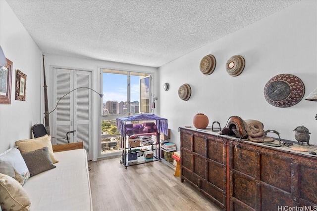 1350 Ala Moana Blvd Unit 3004, Honolulu, HI 96814 - living area with light wood finished floors and a textured ceiling