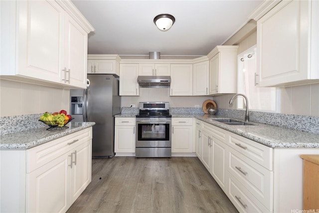 92-1020 Palailai Pl, Kapolei, HI 96707 - kitchen with stainless steel appliances, ventilation hood, white cabinets, light wood-type flooring, and light stone counters