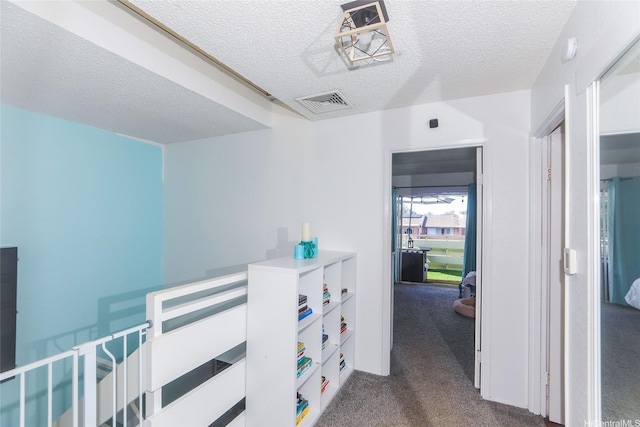 94-271 Kupulau Pl, Mililani, HI 96789 - hallway with a textured ceiling and dark colored carpet