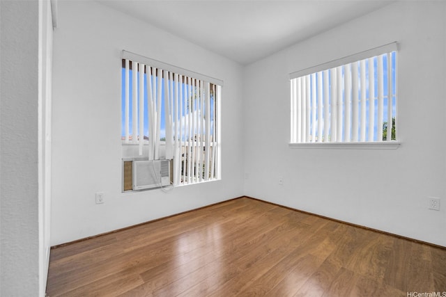 94-1023 Maiau St Unit 172, Waipahu, HI 96797 - unfurnished room with wood finished floors and cooling unit