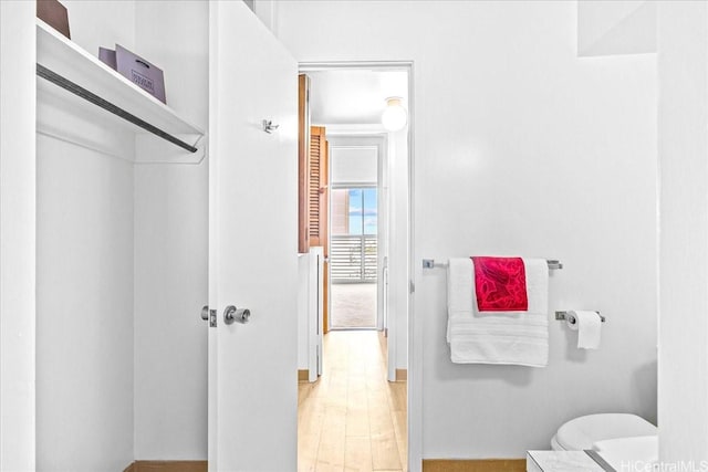 1676 Ala Moana Blvd Unit 1303, Honolulu, HI 96815 - bathroom with toilet and wood finished floors
