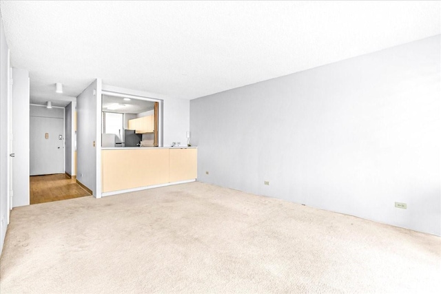 1676 Ala Moana Blvd Unit 1303, Honolulu, HI 96815 - unfurnished living room with light colored carpet