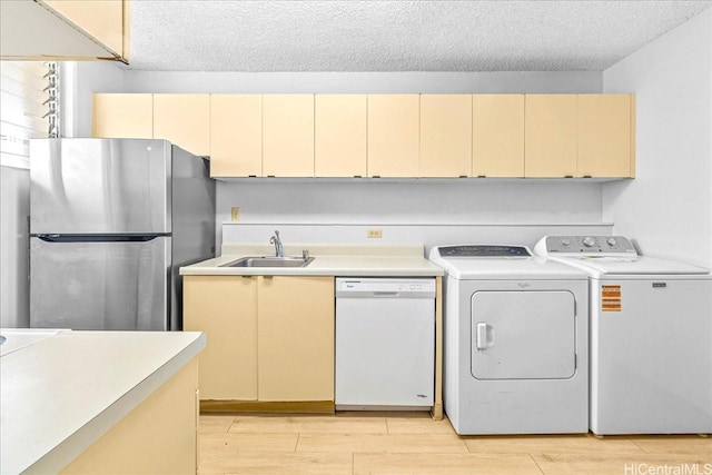 1676 Ala Moana Blvd Unit 1303, Honolulu, HI 96815 - kitchen featuring white dishwasher, freestanding refrigerator, cream cabinets, light countertops, and a textured ceiling