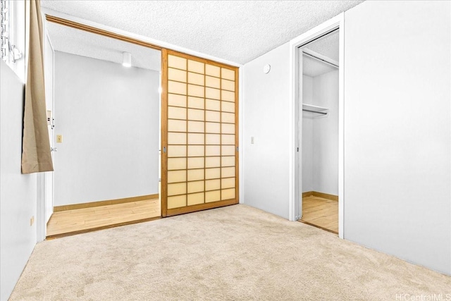 1676 Ala Moana Blvd Unit 1303, Honolulu, HI 96815 - unfurnished bedroom with carpet floors, a textured ceiling, and a closet