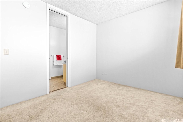 1676 Ala Moana Blvd Unit 1303, Honolulu, HI 96815 - unfurnished bedroom featuring carpet and a textured ceiling