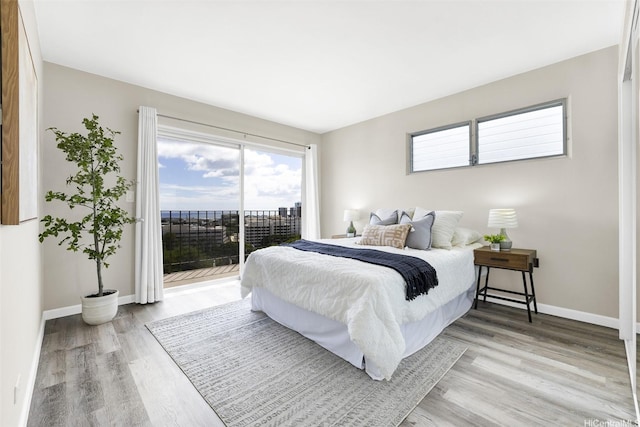 625 Iolani Ave Unit A304, Honolulu, HI 96813 - bedroom with access to exterior and light wood-style floors