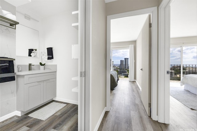 625 Iolani Ave Unit A304, Honolulu, HI 96813 - full bathroom with connected bathroom, vanity, wood finished floors, and healthy amount of natural light