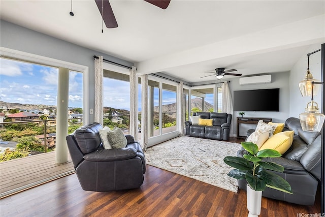 1048 Kaupaku Pl, Honolulu, HI 96825 - living room featuring a ceiling fan, a wall mounted air conditioner, and wood finished floors