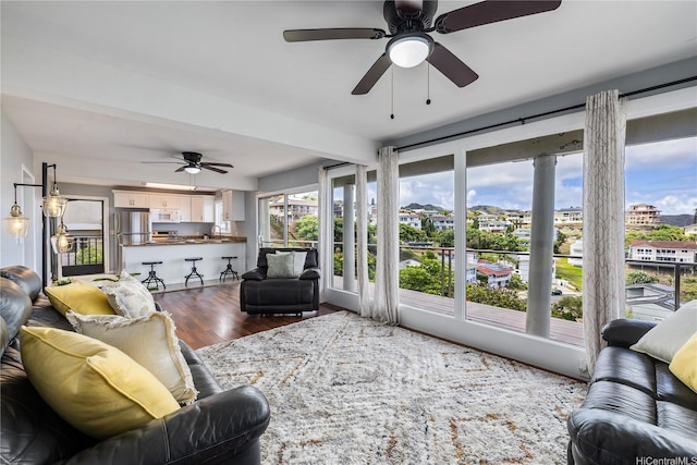 1048 Kaupaku Pl, Honolulu, HI 96825 - living area with dark wood-style flooring and a ceiling fan