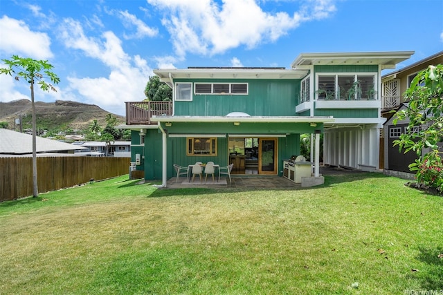1371 Hele St, Kailua, HI 96734 - back of property featuring a fenced backyard, a patio, and a mountain view