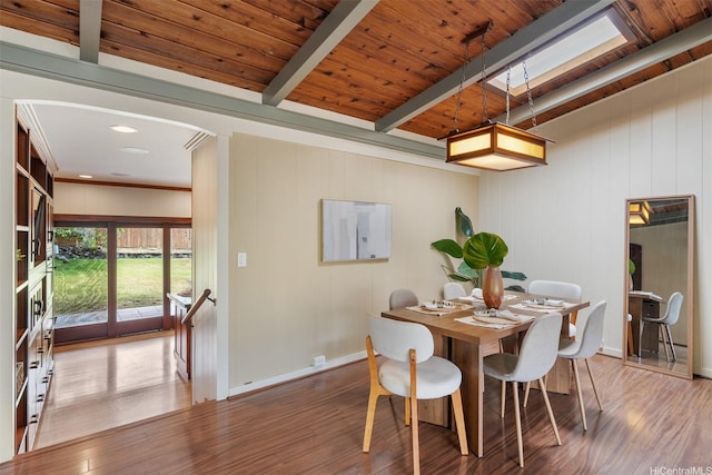 1371 Hele St, Kailua, HI 96734 - dining space featuring wood finished floors, a skylight, a wooden ceiling with exposed beams, and arched walkways