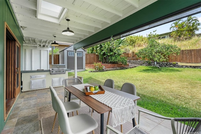 1371 Hele St, Kailua, HI 96734 - fenced backyard featuring a storage shed, outdoor dining area, a patio area, and exterior kitchen