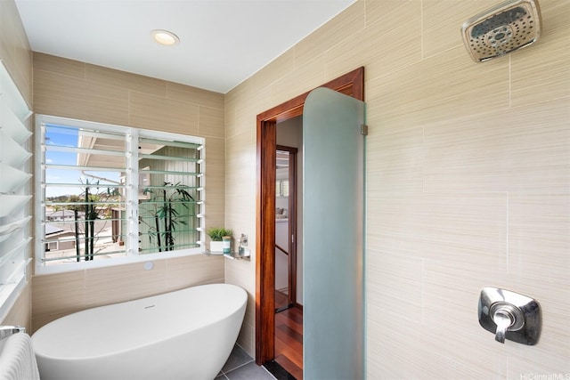 1371 Hele St, Kailua, HI 96734 - full bath with a freestanding tub, tile walls, tile patterned floors, and radiator heating unit