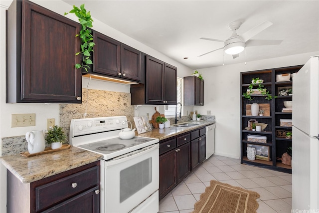 54-18 Haukoi Pl, Hauula, HI 96717 - kitchen with white appliances, a ceiling fan, dark brown cabinetry, light tile patterned floors, and light stone counters