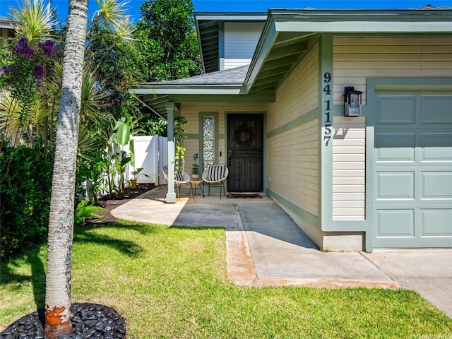 94-1157 Kaloli Loop, Waipahu, HI 96797 - entrance to property with a garage, a lawn, and roof with shingles