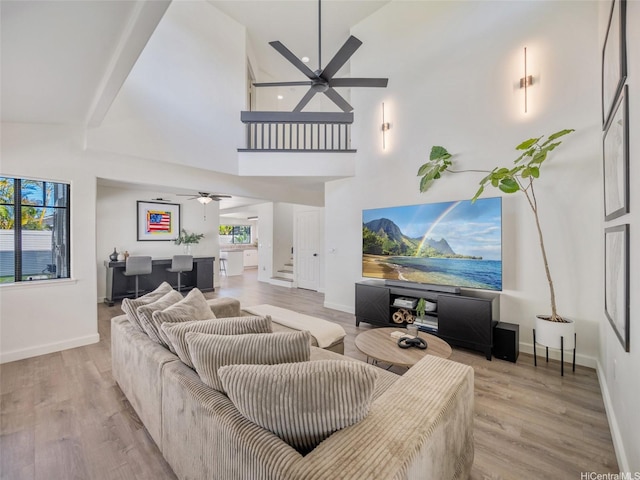 94-1157 Kaloli Loop, Waipahu, HI 96797 - living room featuring a ceiling fan, wood finished floors, stairway, and a high ceiling