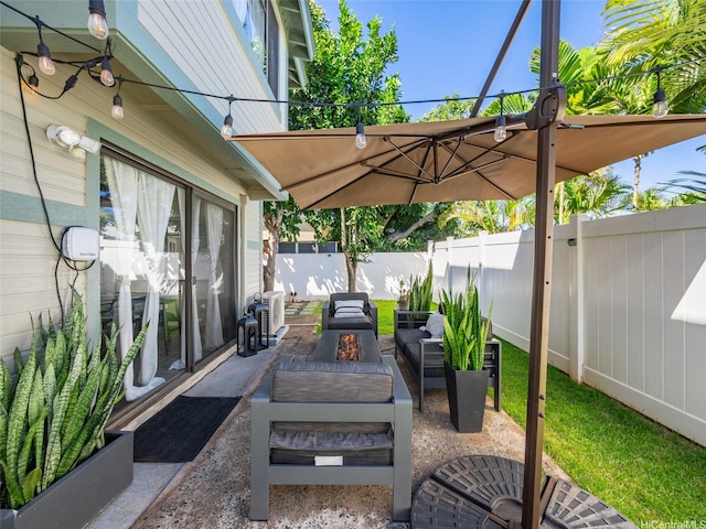94-1157 Kaloli Loop, Waipahu, HI 96797 - fenced backyard with a patio area and an outdoor living space with a fire pit