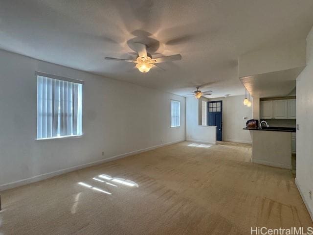 92-1055 Koio Dr Unit M36-6, Kapolei, HI 96707 - unfurnished living room featuring a ceiling fan and light carpet