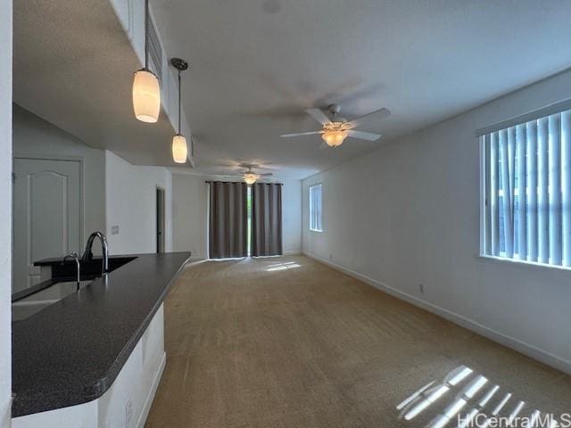 92-1055 Koio Dr Unit M36-6, Kapolei, HI 96707 - unfurnished living room with ceiling fan and light carpet