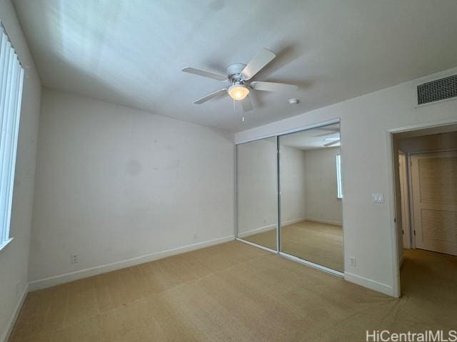 92-1055 Koio Dr Unit M36-6, Kapolei, HI 96707 - unfurnished bedroom with light carpet, a closet, and ceiling fan