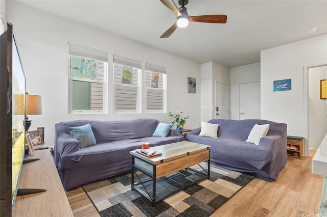 91-1640 Honouliuli St Unit 82, Ewa Beach, HI 96706 - living area featuring light wood finished floors and a ceiling fan